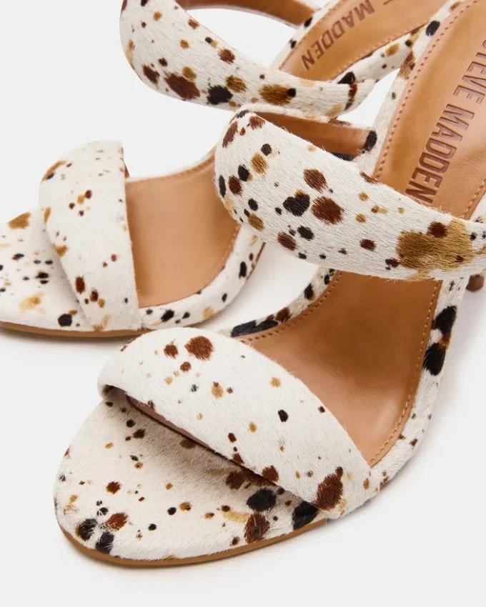 Saturn Braun mit Kuhfellmuster